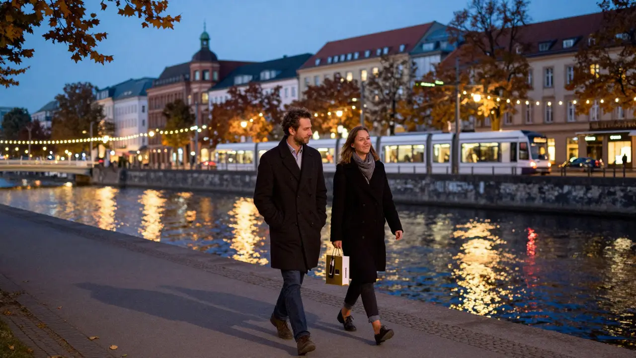 Two people walking peacefully along the Spree River in Berlin at dusk, in quiet companionship.